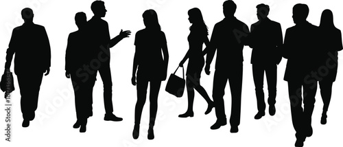 Silhouetted group of diverse people walking and interacting in urban environment representing modern business community and lifestyle scene