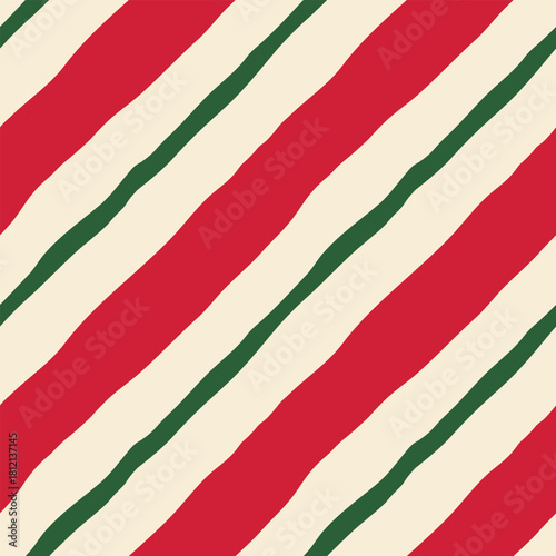 Bright diagonal striped vector seamless pattern. Modern, playful, minimal red and green hand drawn candy stripes repeat design on cream background. Festive geometric tile for fabrics, wrapping, media