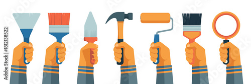 Hands holding various renovation, construction and diy tools