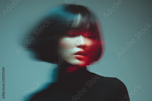 Abstract portrait of woman with bob haircut featuring teal and red motion streak effects