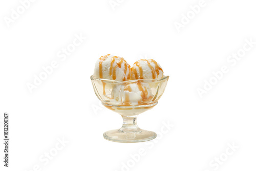 Three scoops of ice cream with syrup. Clear.