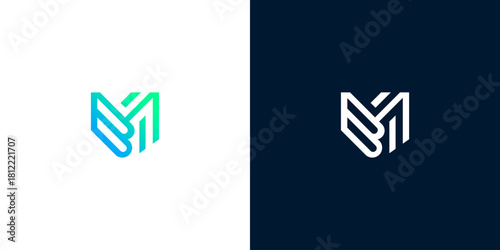 Abstract letter M or V monogram logo design in a modern geometric shield shape with a vibrant blue and green gradient