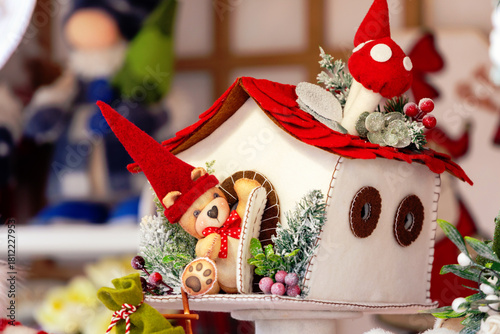 Felt Christmas decorations with teddy bear in snow house