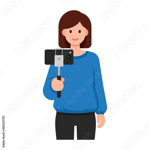 Happy woman using a portable selfie stick to capture engaging video for social media platforms