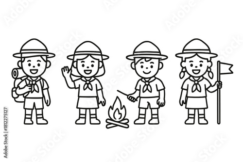 Happy group of young scout children standing around a small campfire during a camping trip