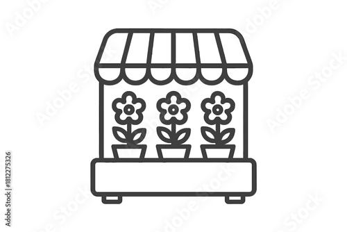 Retail flower market stall with potted blooming plants displayed under a striped awning