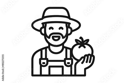 Smiling bearded farmer wearing a hat and overalls holding a freshly harvested ripe red tomato