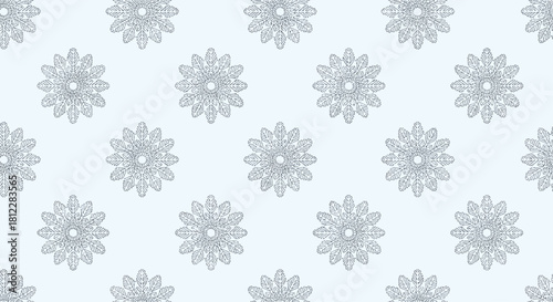 Elegant seamless winter pattern with intricate blue snowflakes or mandalas on a light background for holiday textile and wrapping paper.