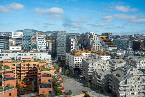 Architecture cityscape in Oslo highlighting Barcode daytime waterfront housing buildings and rooftops expanding into a spacious modern urban landscape.