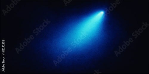 Single blue spotlight beam shining upwards on a dark background