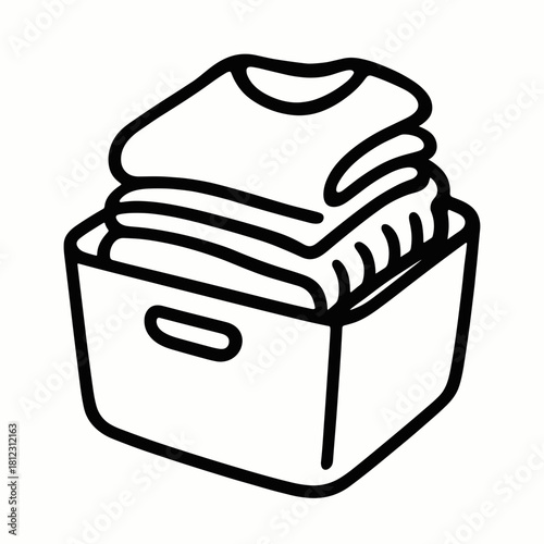 Folded sweaters in fabric bin