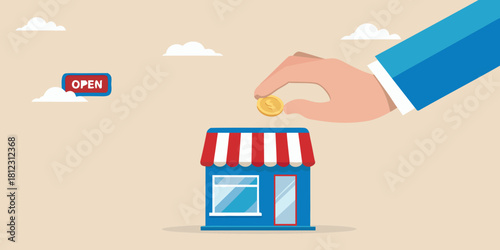 Hand placing coin into small business building