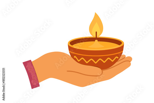 Hand holding traditional clay diya lamp with bright flame for Hindu Diwali festival celebration