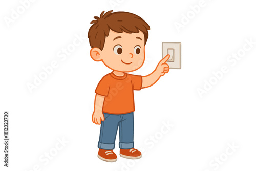 Cheerful young boy smiling while operating a wall-mounted light switch with his finger