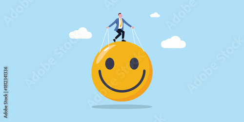 Businessman controlling a giant smiley face with strings