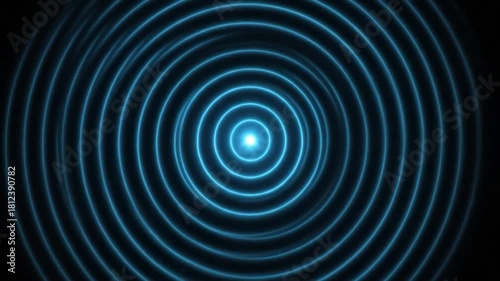 Concentric circles of blue light emanate from a central glowing point