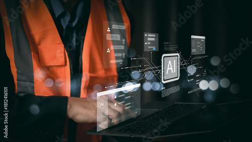 Industrial engineer using laptop with futuristic AI hologram interface. Smart industry 4.0 technology concept. Construction worker analyzing data with artificial intelligence network.