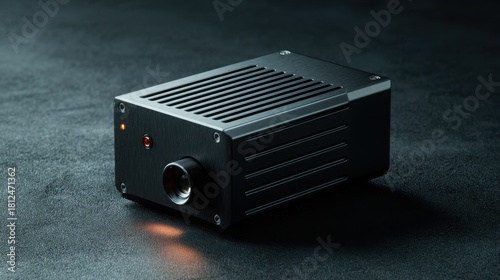 angular high power laser module with visible vents metal texture subtle glowing indicators dark matte background product showcase clean detail