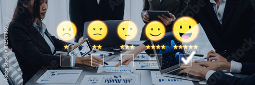 A diverse business team engaging in a project review, using emoticons to express feedback and analyze performance metrics through digital devices in a modern office atmosphere. Trope