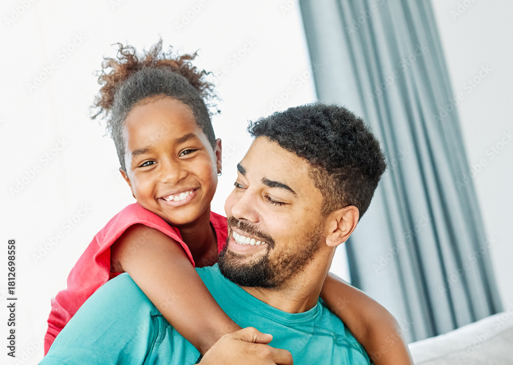 Obraz premium Portrait of father and daughter having fun at home
