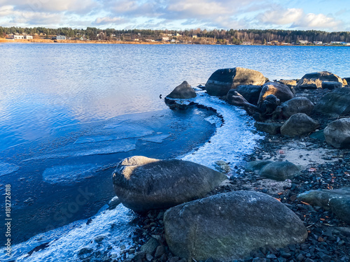 Winter landscape. The shore of Lake Onega covered with the first ice. Karelia