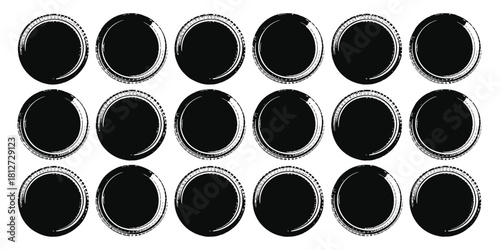 A collection of twenty one black grunge circles arranged in rows on a white background surface