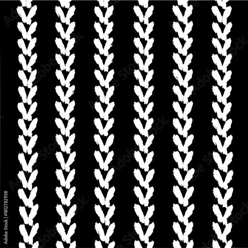 Vertical rows of white chevron shapes forming a pattern on a black background creating a textile design