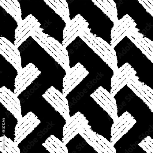 Monochrome chevron pattern with textured white arrows on a dark background creating a bold design