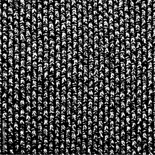 Close up view of a knitted fabric pattern with a repeating design in black and white color scheme texture