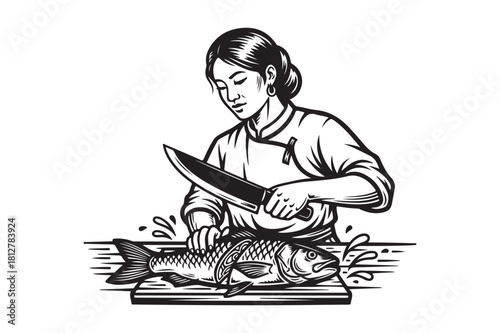 Chef skillfully prepares a fresh fish on a wooden cutting board