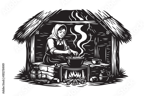 Woman cooking in a rustic thatched hut with a fire