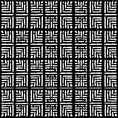 Black and white geometric pattern featuring square shapes with intricate line arrangements forming a dense grid layout
