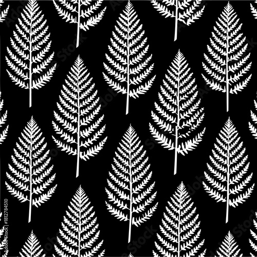 Seamless pattern of white fern leaves on a black background creating a natural botanical design look and feel
