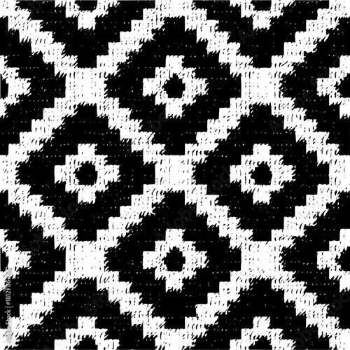 Black and white seamless pattern featuring abstract floral and geometric shapes in a repeating design