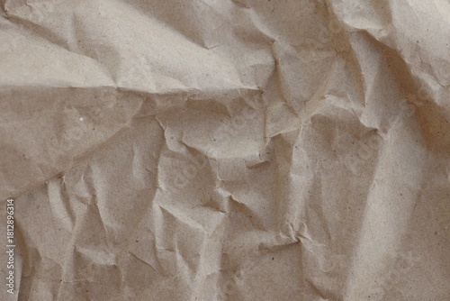 Brown crumpled recycled paper texture background. Kraft Paper