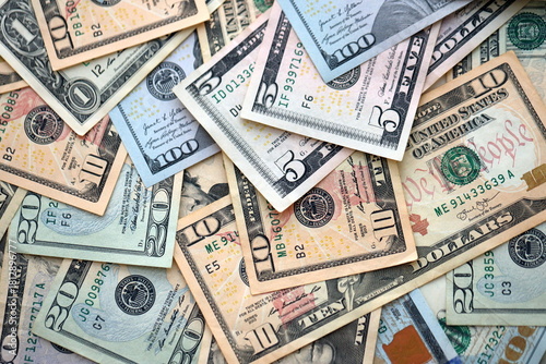 Big amount of different dollar bills close up. Hundred fifty twenty ten and five dollar banknotes