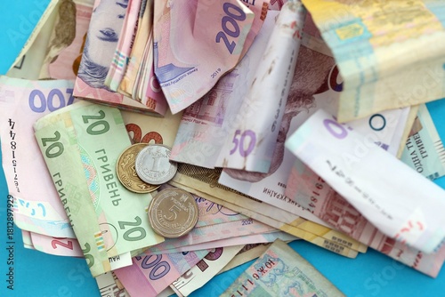 Big amount of different Ukrainian hryvnia money bills. Pile of crumpled ukrainian banknotes