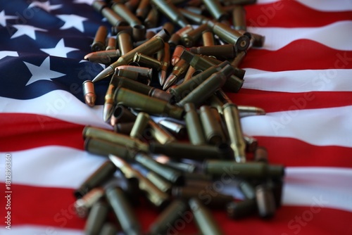 Bullets with USA flag in dark light. Patriotic background image with ammo and United States flag