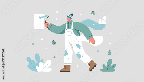 Holiday prep Person painting fresh background with roller surrounded by winter decor