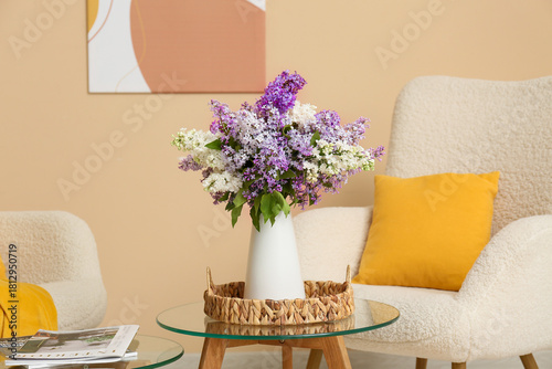 Vase with lilac flowers on ...