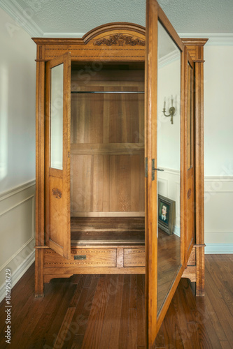 Vintage wooden wardrobe inside an empty room