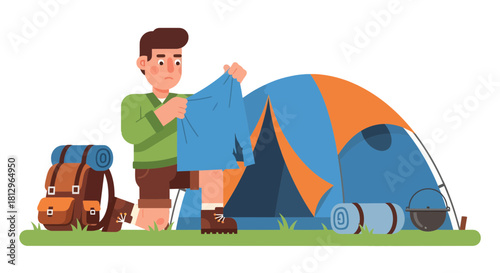 Camping Preparation: A Man Checks His Clothes Outside Of A Tent On The Green Meadow