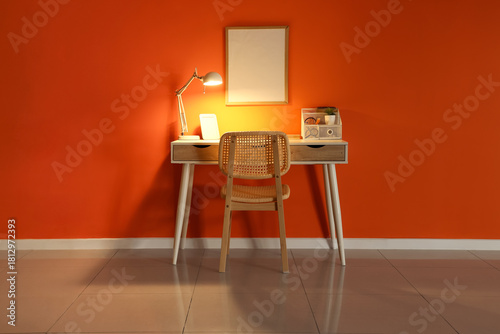 Workplace with glowing lamp...
