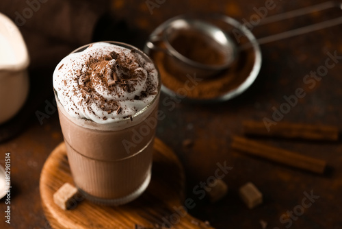 Glass of cocoa drink with w...