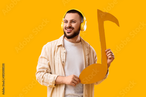 Young man in headphones wit...