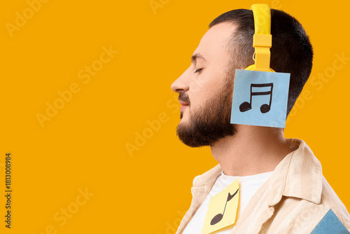 Young man in headphones wit...