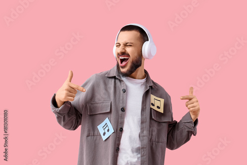 Singing young man in headph...