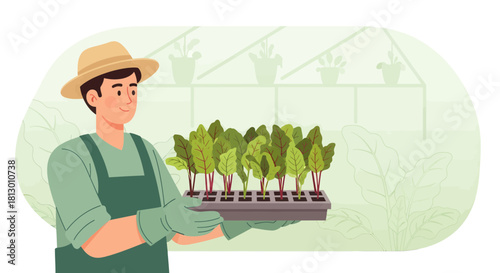 Gardener Smiling While Carrying Seedlings Inside a Greenhouse For Cultivation and Growth