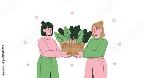 Two Women Holding a Basket of Freshly Harvested Plants Against a Black Background
