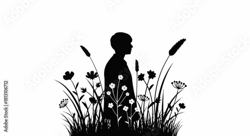 Silhouette of a person standing amidst flowers and grass in nature.